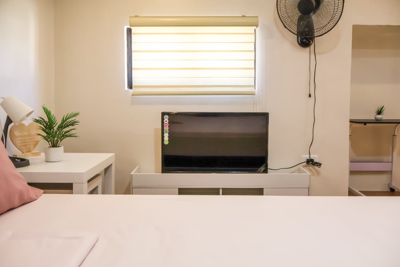 Bedroom with queen bed at HavenInLipa Cozy 1BR rental Lipa City